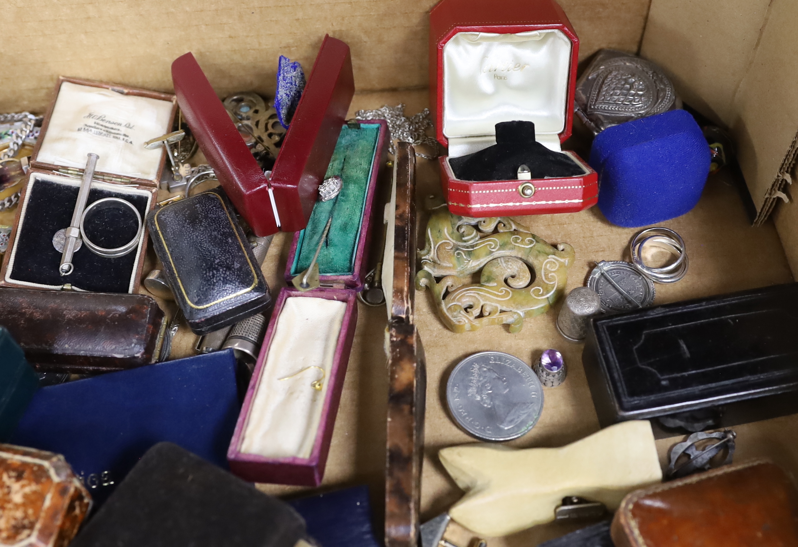 A large quantity of assorted collectables and curios including stick pins, brooches, pens, Links silver cufflinks, coins, jewellery boxes including two Cartier, rings, pendants etc.